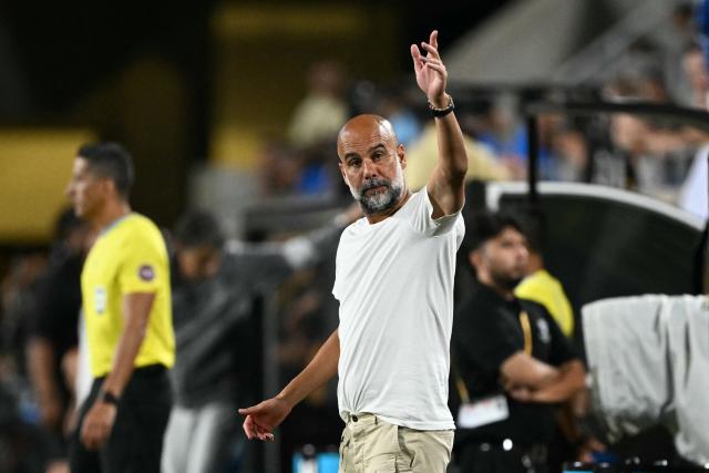 Manchester City's Spanish head coach Pep Guardiola gestures during the FIFA Club World Cup 2025 round of 16 football match between England's Manchester City and Saudi's Al-Hilal at the Camping World stadium in Orlando on June 30, 2025. (Photo by PATRICIA DE MELO MOREIRA / AFP)