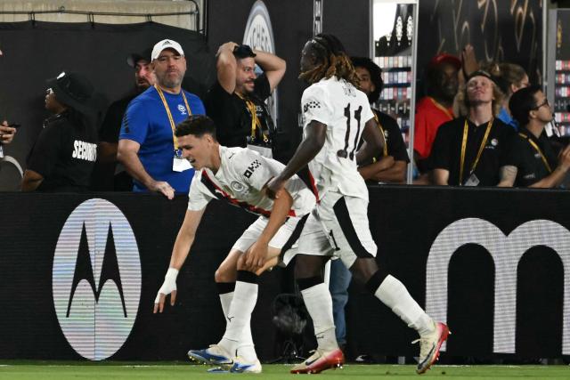 Manchester City's English midfielder #47 Phil Foden (L) celebrates next to teammate Belgian midfielder #11 Jeremy Doku after scoring his team's third goal during the FIFA Club World Cup 2025 round of 16 football match between England's Manchester City and Saudi's Al-Hilal at the Camping World stadium in Orlando on June 30, 2025. (Photo by PATRICIA DE MELO MOREIRA / AFP)