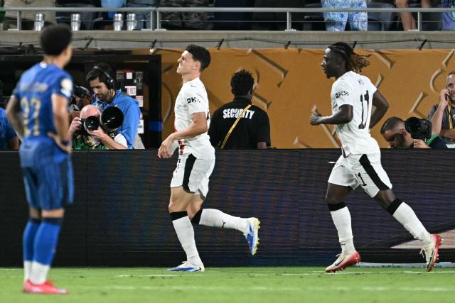 Manchester City's English midfielder #47 Phil Foden (C) celebrates next to teammate Belgian midfielder #11 Jeremy Doku after scoring his team's third goal during the FIFA Club World Cup 2025 round of 16 football match between England's Manchester City and Saudi's Al-Hilal at the Camping World stadium in Orlando on June 30, 2025. (Photo by PATRICIA DE MELO MOREIRA / AFP)