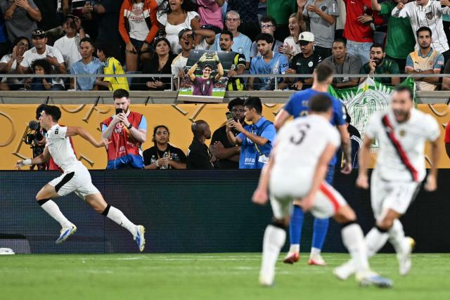 Manchester City's English midfielder #47 Phil Foden (L) celebrates scoring his team's third goal during the FIFA Club World Cup 2025 round of 16 football match between England's Manchester City and Saudi's Al-Hilal at the Camping World stadium in Orlando on June 30, 2025. (Photo by PATRICIA DE MELO MOREIRA / AFP)
