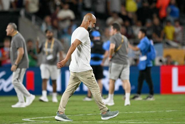 Manchester City's Spanish head coach Pep Guardiola walks on the pitch after losing the FIFA Club World Cup 2025 round of 16 football match between England's Manchester City and Saudi's Al-Hilal at the Camping World stadium in Orlando on June 30, 2025. (Photo by CHANDAN KHANNA / AFP)