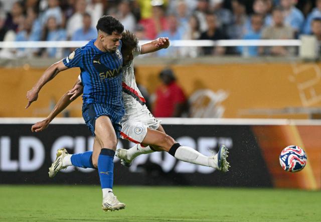 Al Hilal's Brazilian forward #11 Marcos Leonardo and Manchester City's Portuguese defender #03 Ruben Dias fight for the ball during the FIFA Club World Cup 2025 round of 16 football match between England's Manchester City and Saudi's Al-Hilal at the Camping World stadium in Orlando on June 30, 2025. (Photo by CHANDAN KHANNA / AFP)
