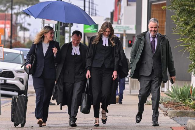 (L-R) Lawyer Ophelia Holloway, barrister Colin Mandy, barrister Sophie Stafford and lawyer Bill Doogue arrive at the Latrobe Valley Magistrates' Court in Morwell on July 1, 2025. Jury members retired on June 30 to decide the fate of an Australian woman accused of murdering three members of her husband's family with a toxic mushroom-laced beef Wellington lunch. Jurors began deliberating their verdict on 50-year-old home cook Erin Patterson after a nine-week trial. (Photo by WILLIAM WEST / AFP)