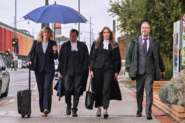 (L-R) Lawyer Ophelia Holloway, barrister Colin Mandy, barrister Sophie Stafford and lawyer Bill Doogue arrive at the Latrobe Valley Magistrates' Court in Morwell on July 1, 2025. Jury members retired on June 30 to decide the fate of an Australian woman accused of murdering three members of her husband's family with a toxic mushroom-laced beef Wellington lunch. Jurors began deliberating their verdict on 50-year-old home cook Erin Patterson after a nine-week trial. (Photo by WILLIAM WEST / AFP)