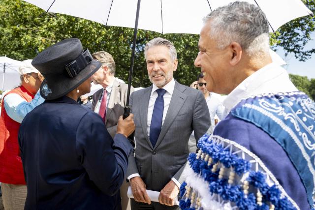 Dutch outgoing Prime Minister Dick Schoof (C) waits before attending the 23rd National Slavery Commemoration day at the National Slavery Monument in Amsterdam's Oosterpark on July 1, 2025. The ceremony commemorates the abolition of slavery on July 1, 1863 in Netherland's former colony Suriname and the Caribbean part of the Dutch Kingdom. (Photo by Ramon van Flymen / ANP / AFP) / Netherlands OUT