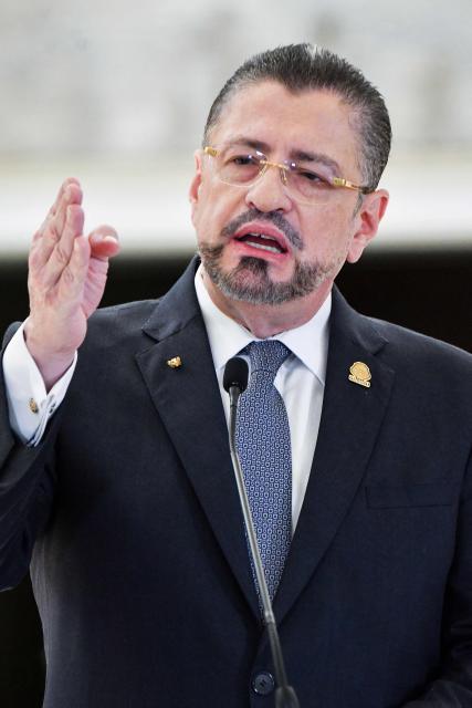 (FILES) Costa Rica's President Rodrigo Chaves gestures as he speaks during a press conference at the presidential house in San Jose on April 23, 2025. Costa Rica's Supreme Court on July 1, 2025, urged the congress to strip President Rodrigo Chaves of his immunity from prosecution so he can be tried on corruption charges. Chaves is accused of forcing a communications services company hired by the presidency to give $32,000 to his friend and former image advisor Federico Cruz. (Photo by Ezequiel BECERRA / AFP)