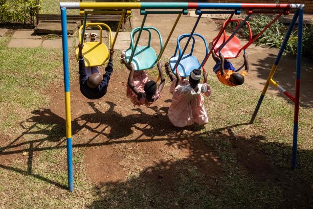 Child patients at Hospice Africa Uganda (HAU) play on a swing after meeting with their assigned nurses at the hospice in Kampala, on June 24, 2025. Hospice Africa Uganda (HAU), founded in 1993 by Dr Anne Merriman, brought holistic end-of-life care to Uganda at a time when it was offered in only three African countries.
By the time Merriman died in May 2025, aged 90, she had treated more than 40,000 patients in Uganda and her model had spread to 37 African countries. (Photo by Badru Katumba / AFP)