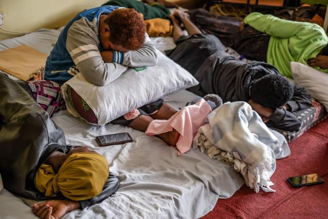 Patients rest in beds after seeing the Hero's Medal awarded to Dr. Anne Merriman by the President of Uganda at the hospice in Kampala, on June 24, 2025. Hospice Africa Uganda (HAU), founded in 1993 by Dr Anne Merriman, brought holistic end-of-life care to Uganda at a time when it was offered in only three African countries.
By the time Merriman died in May 2025, aged 90, she had treated more than 40,000 patients in Uganda and her model had spread to 37 African countries. (Photo by Badru Katumba / AFP)
