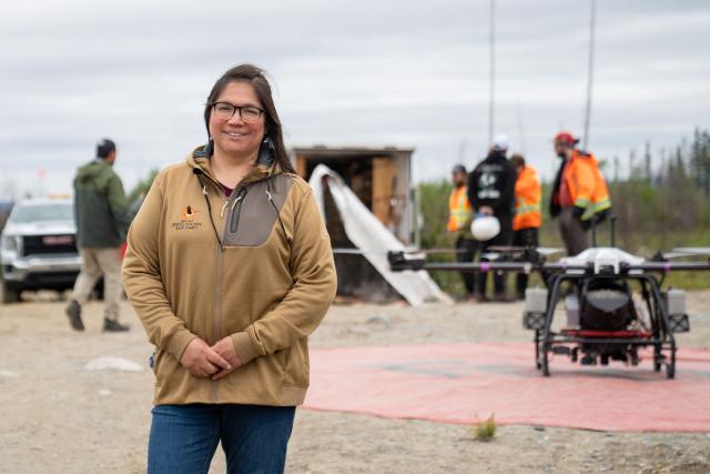 Angel Mianscum, Deputy Chief of the Ouje-Bougoumou Cree Nation, stands for a portrait in Chibougamau, Quebec, Canada, a location where the company Flash Forest uses drones to plant tree seeds, on June 19, 2025. Forests in Northern Quebec province were ravaged by wildfires in the summer of 2023 and for the second year in a row a pilot project has been using drones to plant new black spruces and jack pines. Rather than simply dropping seeds from high above, the company Flash Forest, which is leading the initiative, uses seeds protected in capsules that also contain water and nutrients, as well as fungi, to maximize their growing potential. "It's sad to have lost so much forest," laments Angel Mianscum, one of the Indigenous leaders of a nearby Cree community.
She is, however, pleased to see that there are now "innovative ways of doing things." The Cree community has worked directly with Flash Forest to plan the local reforestation. Indigenous communities are the most affected by fires in Canada because they are often remote and deep in the boreal forest. (Photo by François Robert-Durand / AFP)