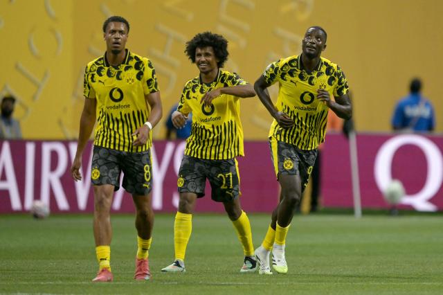 Borussia Dortmund's Guinean forward #09 Serhou Guirassy (R) celebrates with teammates German midfielder #08 Felix Nmecha (L) and German forward #27 Karim Adeyemi after scoring his team's first goal during the FIFA Club World Cup 2025 round of 16 football match between Germany's Borussia Dortmund and Mexico's Monterrey at the Mercedes-Benz Stadium in Atlanta on July 1, 2025. (Photo by Juan MABROMATA / AFP)