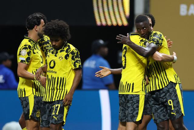 Borussia Dortmund's Guinean forward #09 Serhou Guirassy (R) celebrates scoring his team's second goal with teammates during the FIFA Club World Cup 2025 round of 16 football match between Germany's Borussia Dortmund and Mexico's Monterrey at the Mercedes-Benz Stadium in Atlanta on July 1, 2025. (Photo by CHARLY TRIBALLEAU / AFP)