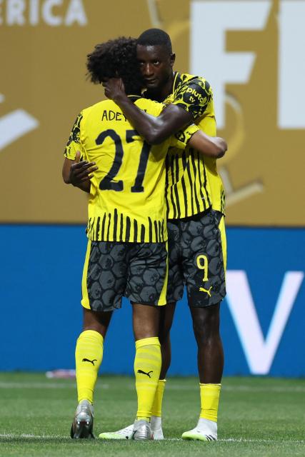 Borussia Dortmund's Guinean forward #09 Serhou Guirassy (R) celebrates scoring his team's second goal with teammate German forward #27 Karim Adeyemi during the FIFA Club World Cup 2025 round of 16 football match between Germany's Borussia Dortmund and Mexico's Monterrey at the Mercedes-Benz Stadium in Atlanta on July 1, 2025. (Photo by CHARLY TRIBALLEAU / AFP)
