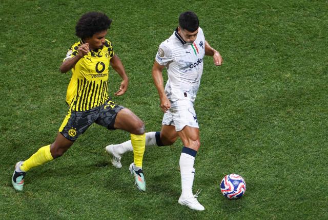 Borussia Dortmund's German forward #27 Karim Adeyemi (L) and Monterrey's Argentine midfielder #30 Jorge Rodriguez (R) fight for the ball during the FIFA Club World Cup 2025 round of 16 football match between Germany's Borussia Dortmund and Mexico's Monterrey at the Mercedes-Benz Stadium in Atlanta on July 1, 2025. (Photo by Franck FIFE / AFP)