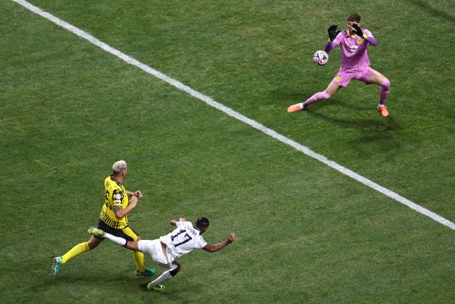 Borussia Dortmund's Swiss goalkeeper #01 Gregor Kobel makes a save past Monterrey's Mexican forward #17 Jesus Corona during the FIFA Club World Cup 2025 round of 16 football match between Germany's Borussia Dortmund and Mexico's Monterrey at the Mercedes-Benz Stadium in Atlanta on July 1, 2025. (Photo by Franck FIFE / AFP)