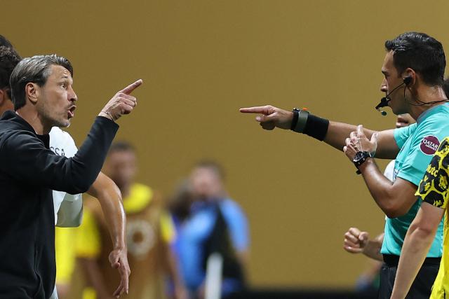 Borussia Dortmund's Croatian head coach Niko Kovac argues with Argentine referee Facundo Tello during the FIFA Club World Cup 2025 round of 16 football match between Germany's Borussia Dortmund and Mexico's Monterrey at the Mercedes-Benz Stadium in Atlanta on July 1, 2025. (Photo by CHARLY TRIBALLEAU / AFP)