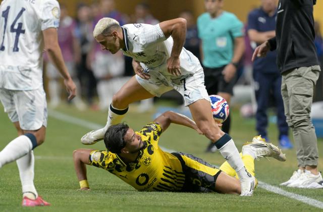 Monterrey's Mexican forward #07 German Berterame (T) and Borussia Dortmund's Algerian defender #05 Ramy Bensebaini (B) fight for the ball during the FIFA Club World Cup 2025 round of 16 football match between Germany's Borussia Dortmund and Mexico's Monterrey at the Mercedes-Benz Stadium in Atlanta on July 1, 2025. (Photo by Juan MABROMATA / AFP)