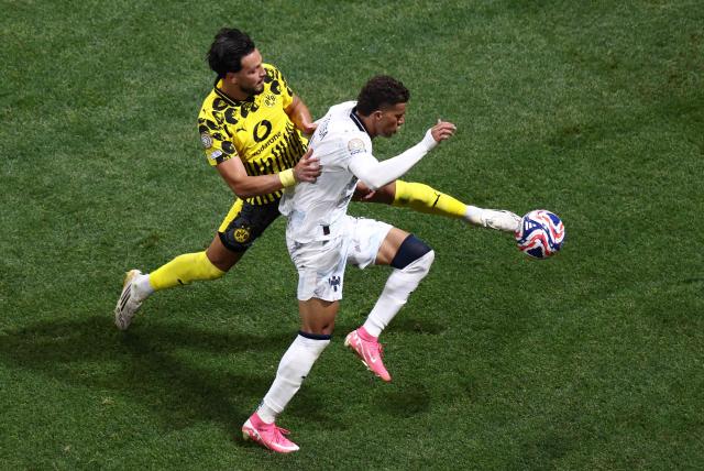 Borussia Dortmund's Algerian defender #05 Ramy Bensebaini and Monterrey's Colombian midfielder #06 Nelson Deossa fight for the ball during the FIFA Club World Cup 2025 round of 16 football match between Germany's Borussia Dortmund and Mexico's Monterrey at the Mercedes-Benz Stadium in Atlanta on July 1, 2025. (Photo by Franck FIFE / AFP)