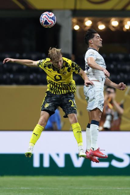 Borussia Dortmund's German forward #14 Maximilian Beier (L) and Monterrey's Mexican midfielder #14 Erick Aguirre (R) fight for the ball during the FIFA Club World Cup 2025 round of 16 football match between Germany's Borussia Dortmund and Mexico's Monterrey at the Mercedes-Benz Stadium in Atlanta on July 1, 2025. (Photo by Charly TRIBALLEAU / AFP)