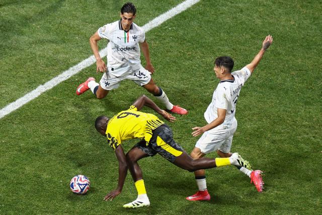 Monterrey's Mexican midfielder #14 Erick Aguirre (L), Borussia Dortmund's Guinean forward #09 Serhou Guirassy (C) and Monterrey's Mexican defender #03 Gerardo Arteaga (R) fight for the ball during the FIFA Club World Cup 2025 round of 16 football match between Germany's Borussia Dortmund and Mexico's Monterrey at the Mercedes-Benz Stadium in Atlanta on July 1, 2025. (Photo by Franck FIFE / AFP)