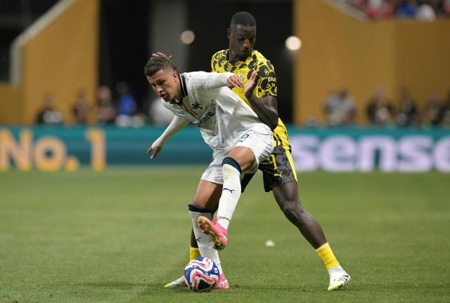 Monterrey's Colombian midfielder #06 Nelson Deossa and Borussia Dortmund's Guinean forward #09 Serhou Guirassy fight for the ball during the FIFA Club World Cup 2025 round of 16 football match between Germany's Borussia Dortmund and Mexico's Monterrey at the Mercedes-Benz Stadium in Atlanta on July 1, 2025. (Photo by Juan MABROMATA / AFP)