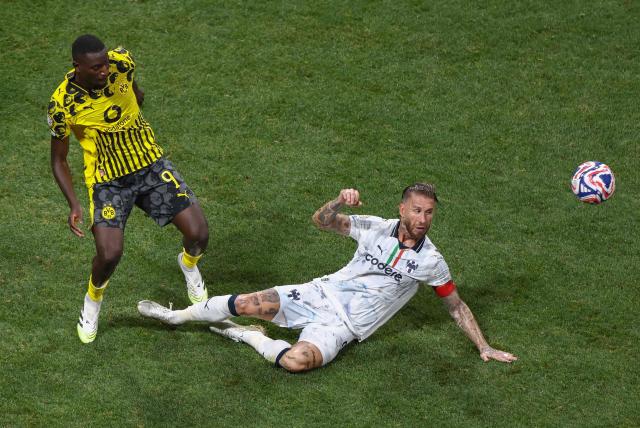 Borussia Dortmund's Guinean forward #09 Serhou Guirassy and Monterrey's Spanish defender #93 Sergio Ramos fight for the ball during the FIFA Club World Cup 2025 round of 16 football match between Germany's Borussia Dortmund and Mexico's Monterrey at the Mercedes-Benz Stadium in Atlanta on July 1, 2025. (Photo by Franck FIFE / AFP)