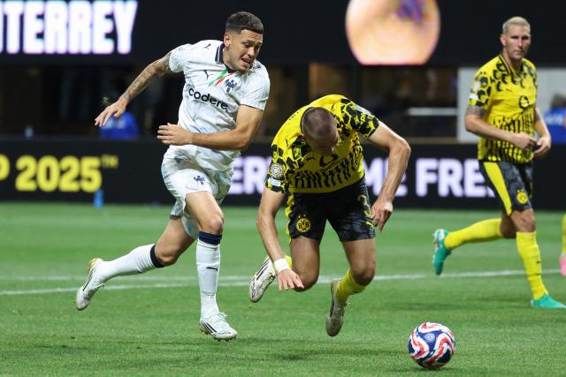 Monterrey's Argentine forward #29 Lucas Ocampos and Borussia Dortmund's German defender #03 Waldemar Anton fight for the ball during the FIFA Club World Cup 2025 round of 16 football match between Germany's Borussia Dortmund and Mexico's Monterrey at the Mercedes-Benz Stadium in Atlanta on July 1, 2025. (Photo by Charly TRIBALLEAU / AFP)