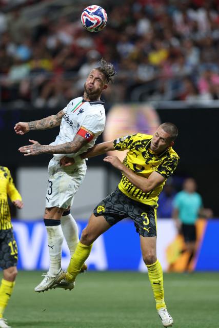 Monterrey's Spanish defender #93 Sergio Ramos and Borussia Dortmund's German defender #03 Waldemar Anton fight for the ball during the FIFA Club World Cup 2025 round of 16 football match between Germany's Borussia Dortmund and Mexico's Monterrey at the Mercedes-Benz Stadium in Atlanta on July 1, 2025. (Photo by CHARLY TRIBALLEAU / AFP)