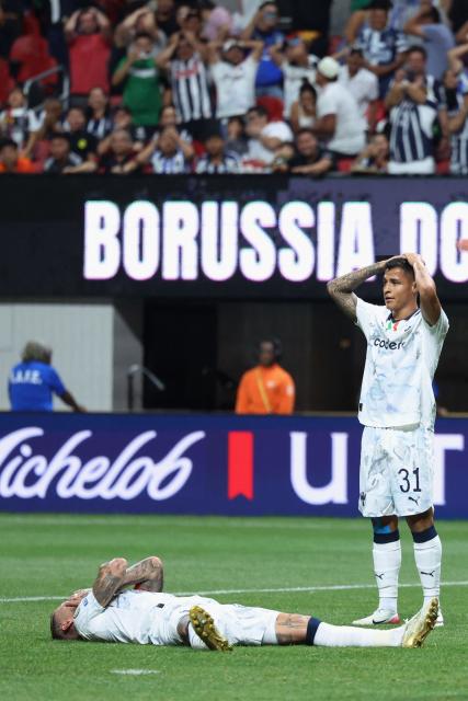 Monterrey's Spanish defender #93 Sergio Ramos (L) and Mexican forward #31 Roberto De La Rosa (R) react during the FIFA Club World Cup 2025 round of 16 football match between Germany's Borussia Dortmund and Mexico's Monterrey at the Mercedes-Benz Stadium in Atlanta on July 1, 2025. (Photo by Charly TRIBALLEAU / AFP)