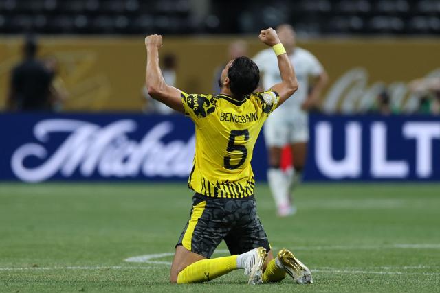 Borussia Dortmund's Algerian defender #05 Ramy Bensebaini celebrates after winning the FIFA Club World Cup 2025 round of 16 football match between Germany's Borussia Dortmund and Mexico's Monterrey at the Mercedes-Benz Stadium in Atlanta on July 1, 2025. (Photo by CHARLY TRIBALLEAU / AFP)