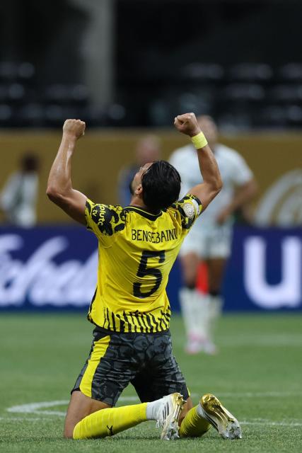 Borussia Dortmund's Algerian defender #05 Ramy Bensebaini celebrates after winning the FIFA Club World Cup 2025 round of 16 football match between Germany's Borussia Dortmund and Mexico's Monterrey at the Mercedes-Benz Stadium in Atlanta on July 1, 2025. (Photo by CHARLY TRIBALLEAU / AFP)