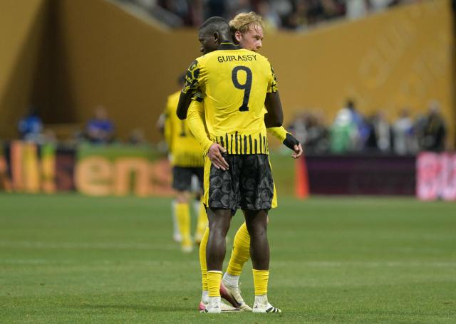 Borussia Dortmund's Guinean forward #09 Serhou Guirassy and teammate German midfielder #10 Julian Brandt react after winning the FIFA Club World Cup 2025 round of 16 football match between Germany's Borussia Dortmund and Mexico's Monterrey at the Mercedes-Benz Stadium in Atlanta on July 1, 2025. (Photo by JUAN MABROMATA / AFP)