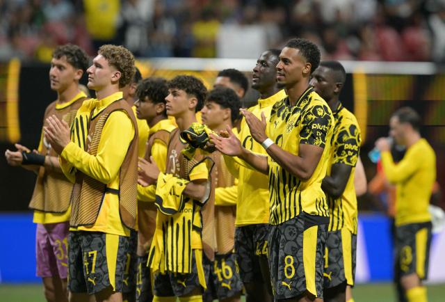 Borussia Dortmund players acknowledge the crowd after winning the FIFA Club World Cup 2025 round of 16 football match between Germany's Borussia Dortmund and Mexico's Monterrey at the Mercedes-Benz Stadium in Atlanta on July 1, 2025. (Photo by JUAN MABROMATA / AFP)