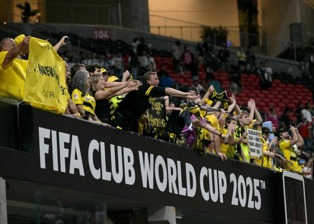 Borussia Dortmund fans celebrate after winning the FIFA Club World Cup 2025 round of 16 football match between Germany's Borussia Dortmund and Mexico's Monterrey at the Mercedes-Benz Stadium in Atlanta on July 1, 2025. (Photo by JUAN MABROMATA / AFP)