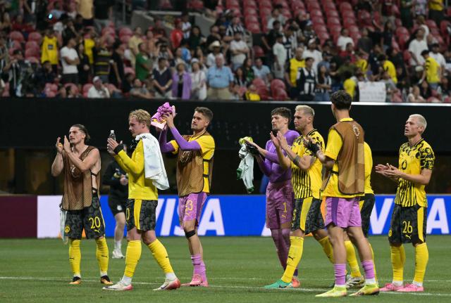 Borussia Dortmund players acknowledge the crowd after winning the FIFA Club World Cup 2025 round of 16 football match between Germany's Borussia Dortmund and Mexico's Monterrey at the Mercedes-Benz Stadium in Atlanta on July 1, 2025. (Photo by JUAN MABROMATA / AFP)