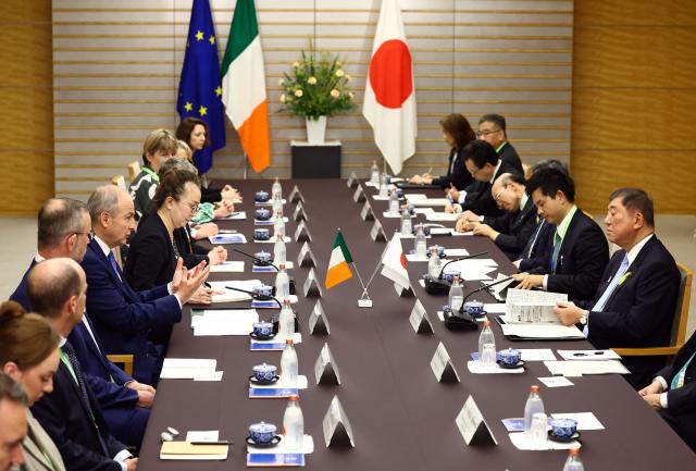 Japanese Prime Minister Shigeru Ishiba (R) attends a meeting with Irish Prime Minister Micheal Martin (5th L) at Ishiba's official residence in Tokyo on July 2, 2025. (Photo by ISSEI KATO / POOL / AFP)