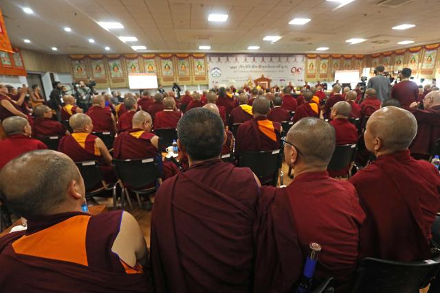 Tibetan monks and nuns attend the 15th Tibetan Religious Conference, a meeting of religious leaders in McLeod Ganj, near Dharamsala on July 2, 2025. Exiled Tibetan spiritual leader the Dalai Lama said on July 2, that the 600-year-old institution will continue after his death, a decision that will have profound impact on his Buddhist followers. (Photo by Sanjay BAID / AFP)