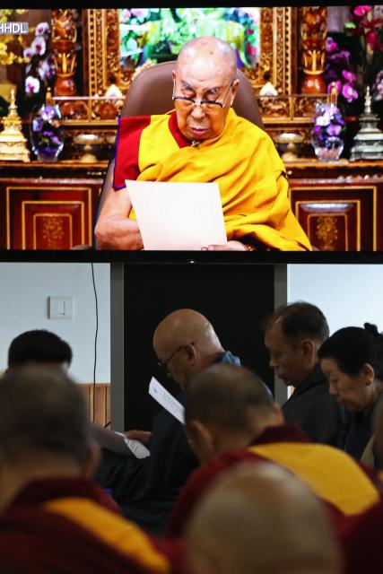 Tibetan spiritual leader the Dalai Lama speaks in a video broadcast at the start of the 15th Tibetan Religious Conference, a meeting of religious leaders in McLeod Ganj, near Dharamsala on July 2, 2025. Exiled Tibetan spiritual leader the Dalai Lama said on July 2, that the 600-year-old institution will continue after his death, a decision that will have profound impact on his Buddhist followers. (Photo by Sanjay BAID / AFP)