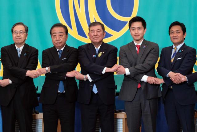 (L–R) Leaders of eight political parties, Komeito Chief Representative Tetsuo Saito, Democratic Party of Japan President Yoshihiko Noda, Japan's Prime Minister and Liberal Democratic Party President Shigeru Ishiba, Governor of Osaka and Japan Innovation Party Co-Representative Hirofumi Yoshimura and Democratic Party For the People Representative Yuichiro Tamaki pose before a debate at the Japan National Press Club in Tokyo on July 2, 2025. (Photo by Tomohiro Ohsumi / POOL / AFP)