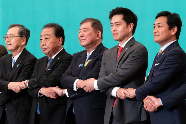 (L–R) Leaders of eight political parties, Komeito Chief Representative Tetsuo Saito, Democratic Party of Japan President Yoshihiko Noda, Japan's Prime Minister and Liberal Democratic Party President Shigeru Ishiba, Governor of Osaka and Japan Innovation Party Co-Representative Hirofumi Yoshimura and Democratic Party For the People Representative Yuichiro Tamaki pose before a debate at the Japan National Press Club in Tokyo on July 2, 2025. (Photo by Tomohiro Ohsumi / POOL / AFP)