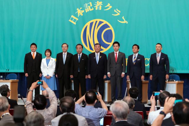 (L-R) Leaders of eight political parties, Sanseito Secretary General Sohei Kamiya, Japanese Communist Party Chairperson Tomoko Tamura, Komeito Chief Representative Tetsuo Saito, Democratic Party of Japan President Yoshihiko Noda, Japan's Prime Minister and Liberal Democratic Party President Shigeru Ishiba, Governor of Osaka and Japan Innovation Party Co-Representative Hirofumi Yoshimura, Democratic Party For the People Representative Yuichiro Tamaki and Reiwa Shinsengumi President Taro Yamamoto take part in a debate at the Japan National Press Club in Tokyo on July 2, 2025. (Photo by Tomohiro Ohsumi / POOL / AFP)