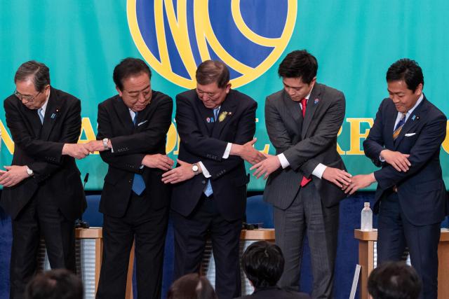 Leaders of eight political parties, including (L–R) Komeito Chief Representative Tetsuo Saito, Democratic Party of Japan President Yoshihiko Noda, Japan's Prime Minister and Liberal Democratic Party President Shigeru Ishiba, Governor of Osaka and Japan Innovation Party Co-Representative Hirofumi Yoshimura and Democratic Party For the People Representative Yuichiro Tamaki pose before a debate at the Japan National Press Club in Tokyo on July 2, 2025. (Photo by Tomohiro Ohsumi / POOL / AFP)