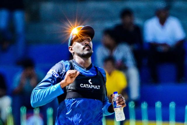 TOPSHOT - Sri Lanka's Milan Rathnayake runs as sunlight reflects off his sunglasses before the start of the first one-day international (ODI) cricket match between Sri Lanka and Bangladesh at the R. Premadasa International Cricket Stadium in Colombo on July 2, 2025. during the first one-day international (ODI) cricket match between Sri Lanka and Bangladesh at the R. Premadasa International Cricket Stadium in Colombo on July 2, 2025. (Photo by Ishara S. KODIKARA / AFP)
