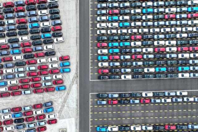 Chinese-made Morris Garages (MG) cars wait to be loaded onto the Chinese-made "Anji Commonality", a liquefied natural gas (LNG) dual-fuel pure car and truck carrier (PCTC) in Lianyungang, in eastern China's Jiangsu province on July 2, 2025. (Photo by AFP) / China OUT