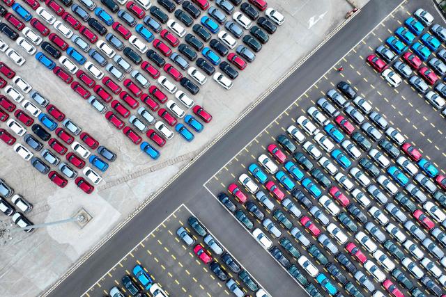 Chinese-made Morris Garages (MG) cars wait to be loaded onto the Chinese-made "Anji Commonality", a liquefied natural gas (LNG) dual-fuel pure car and truck carrier (PCTC) in Lianyungang, in eastern China's Jiangsu province on July 2, 2025. (Photo by AFP) / China OUT