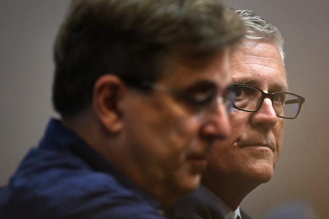 HAC football club owner Vincent Volpe (L) flanked by US co-founder of Blue Crow Sports Group, Jeff Luhnow, gives a media press conference, at the Oceane Stadium, in Le Havre, northwestern France, on July 2, 2025. On June 27, 2025, Vincent Volpe sold HAC to Blue Crow Sports Group. The American group, which already owns several clubs, thus becomes the new owner of the oldest French club. (Photo by Lou BENOIST / AFP)