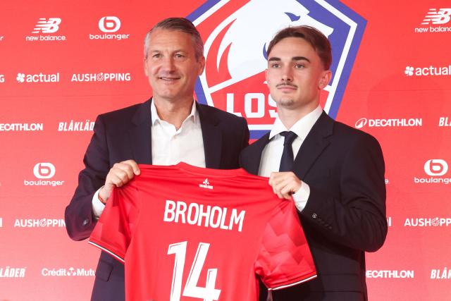 Lille Olympique Sporting Club's (LOSC) president Olivier Letang poses with Lille's Norwegian midfielder Marius Broholm during a press conference to present the new recruits at the Domaine de Luchin (LOSC training centre) in Camphin-en-Pévèle, northern France, on June 2, 2025. (Photo by FRANCOIS LO PRESTI / AFP)