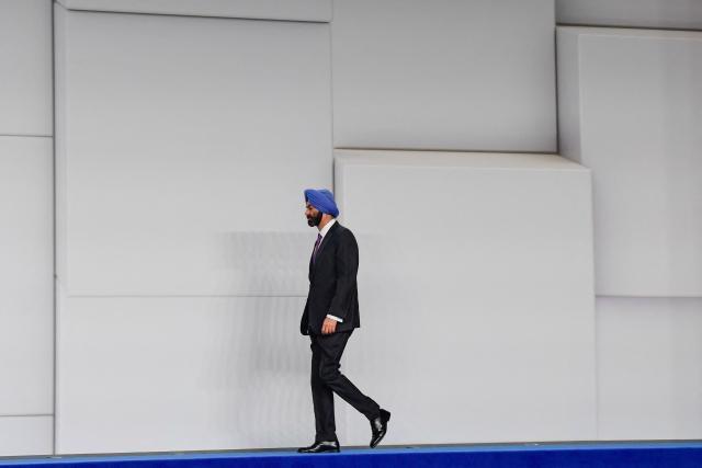 In this picture taken on June 30, 2025, World Bank Group President Ajay Banga walks before a family photo with the rest of heads of state and representatives attending the United Nations 4th International Conference on Financing and Development in Seville. More than 100 nations attending a UN aid conference pledged this week to help defuse the ticking time bomb of developing countries' ballooning debt, but deciding how is proving more divisive. The United Nations puts the annual funding deficit for aid at more than $4 trillion, with chilling consequences for health, education and humanitarian programmes in the poorest countries. (Photo by CRISTINA QUICLER / AFP)