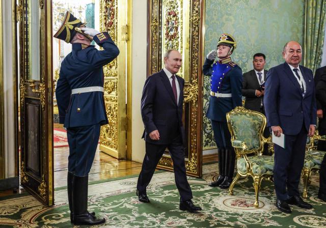Russia's President Vladimir Putin enters a hall during a meeting with his Kyrgyz counterpart at the Kremlin in Moscow on July 2, 2025. (Photo by Maxim Shemetov / POOL / AFP)