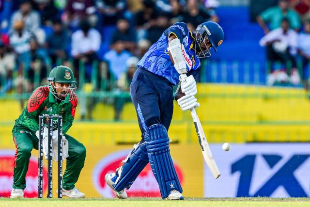 Sri Lanka's Milan Rathnayake (R) plays a shot during the first one-day international (ODI) cricket match between Sri Lanka and Bangladesh at the R. Premadasa International Cricket Stadium in Colombo on July 2, 2025. (Photo by Ishara S. KODIKARA / AFP)