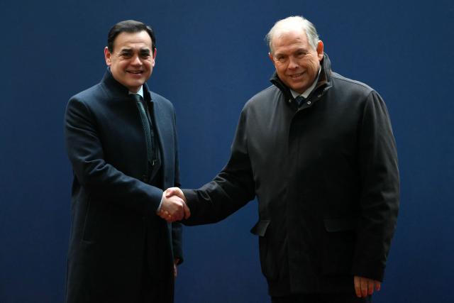 Argentina's Foreign Minister Gerardo Werthein (R) shakes hands with Paraguay's Foreign Minister Ruben Ramirez Lezcano on arrival for the Ordinary Meeting of the Common Market Council (CMC) at the San Martin Palace in Buenos Aires on July 2, 2025, within the framework of the 66th Summit of Leaders of Mercosur and Associated States. Leaders of South America's Mercosur bloc will hold two days of talks in Buenos Aires, focused on a massive trade deal with the European Union being blocked by France. (Photo by Luis ROBAYO / AFP)